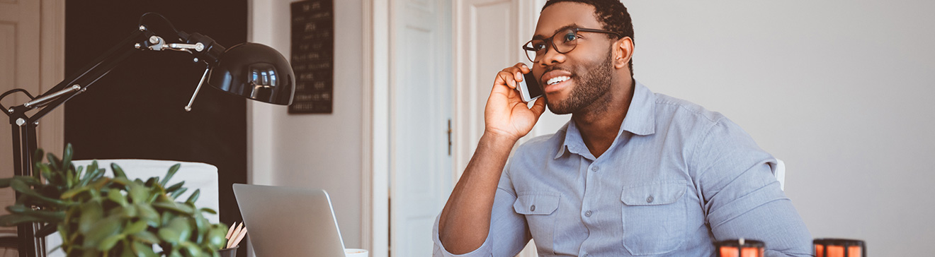 business man on phone with laptop