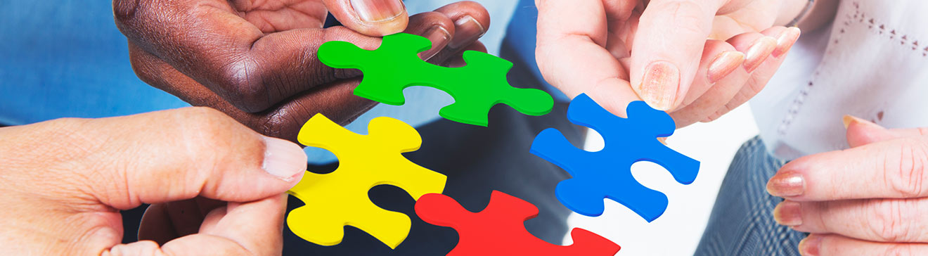 Business people sitting around table having a discussion 